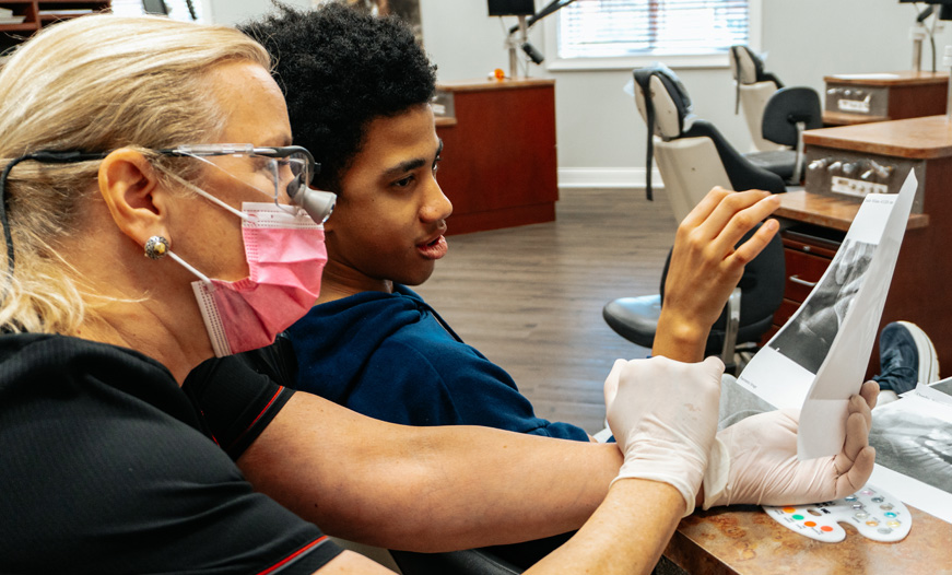 Dr. Lisa with teen patient | Smile Worthy Orthodontics | Orland Park
